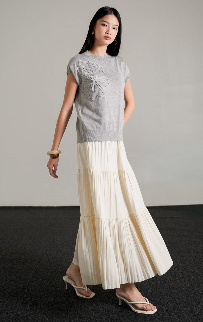 Close-up of delicate flower details and comfortable knit fabric on the Ailynn sleeveless top.