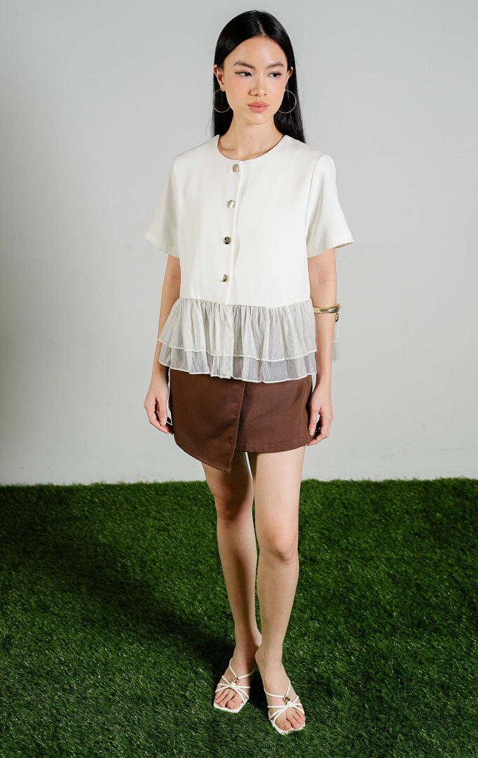 Regulus Gathered Peplum Button-Up Blouse Top warna ivory, baju atasan blouse lengan pendek peplum putih gading dengan kombinasi bahan organza transparan.
