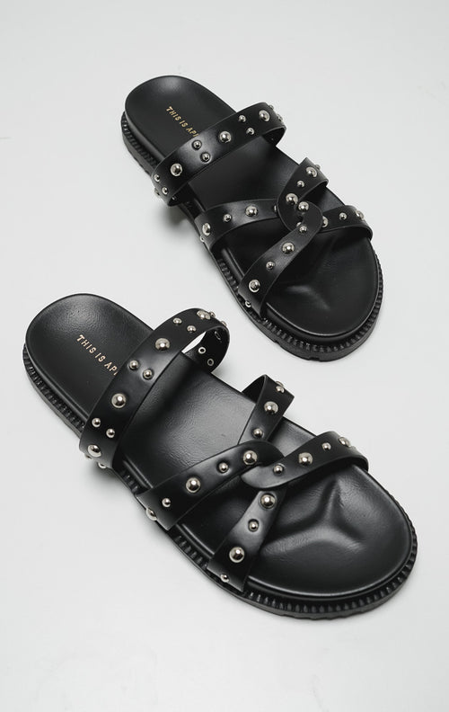Tampak atas sepasang sandal gladiator wanita Azelia Sandals Black dengan tali silang hitam dan hiasan studs perak.