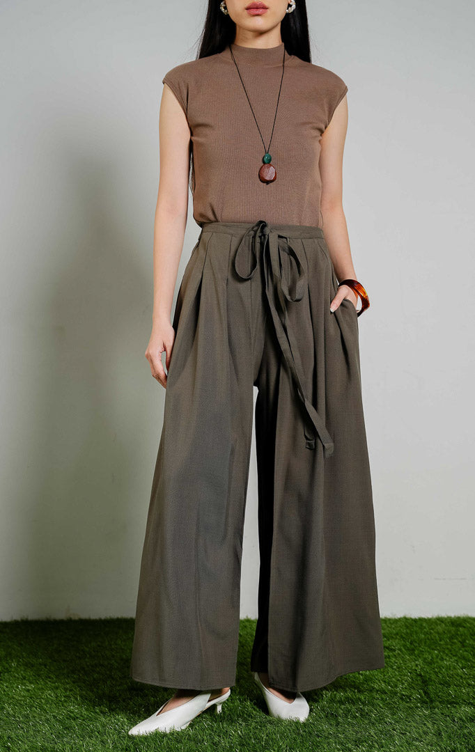 Johnston Tie-Waist Overlap Wide Leg Pants warna army green, celana panjang kulot wanita model tumpuk depan dengan tali pinggang warna hijau army dari This Is April.