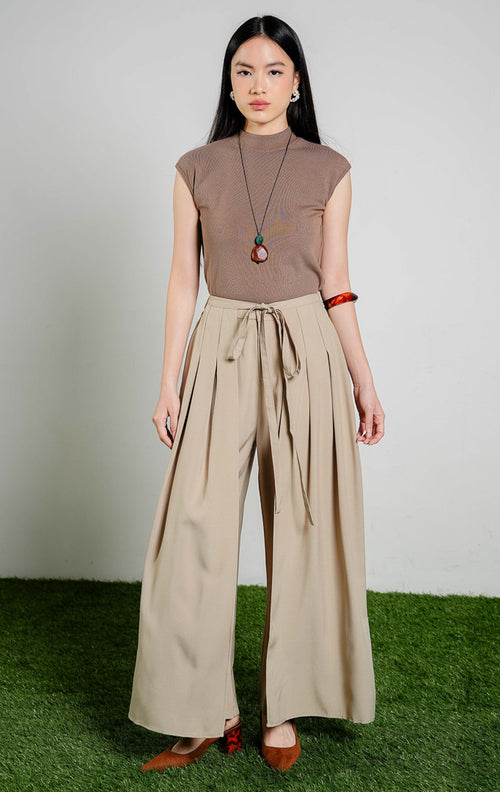 Johnston Tie-Waist Overlap Wide Leg Pants warna khaki, celana panjang kulot wanita model tumpuk depan dengan tali pinggang warna krem khaki dari This Is April.