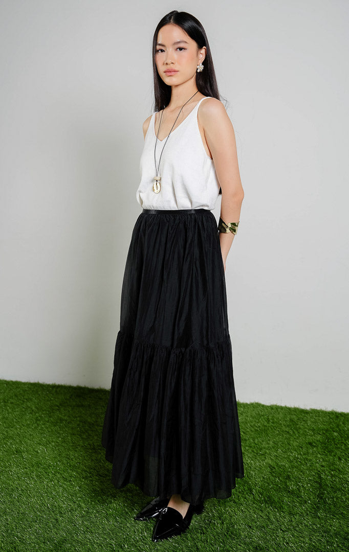 Susanna Flowy Ruffle Maxi Skirt warna black, rok panjang wanita model bertingkat ruffle dengan karet pinggang warna hitam dari This Is April.