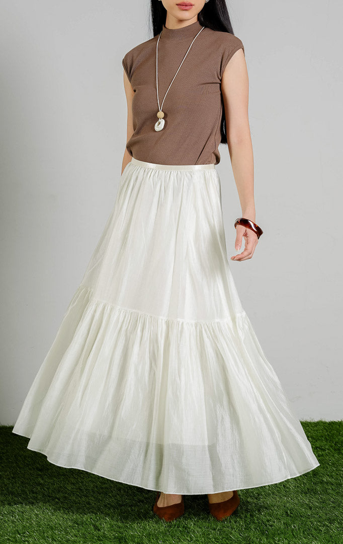 Susanna Flowy Ruffle Maxi Skirt warna ivory, rok panjang wanita model bertingkat ruffle dengan karet pinggang warna putih gading dari This Is April.