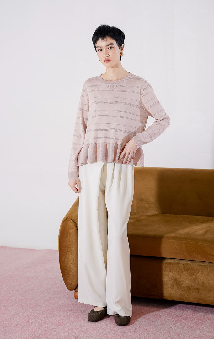 Sweater rajut wanita lengan panjang Arkiana Sweater dari This Is April berwarna dusty pink dengan motif garis berlubang (perforated) horizontal dan detail potongan kerut (ruffle/peplum) di bagian bawah