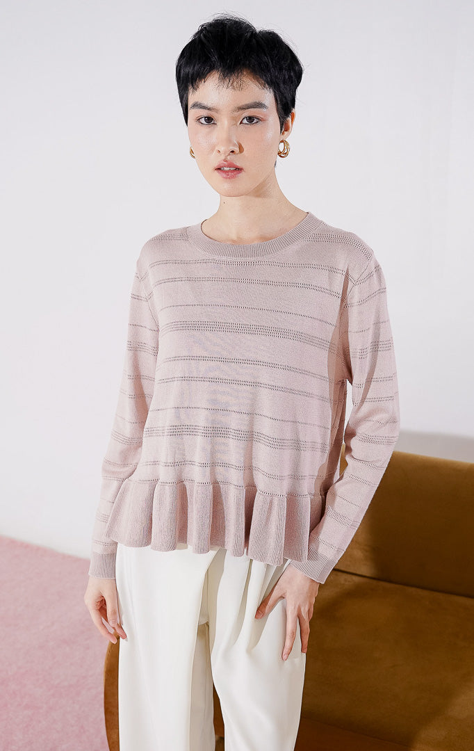 Sweater rajut wanita lengan panjang Arkiana Sweater dari This Is April berwarna dusty pink dengan motif garis berlubang (perforated) horizontal dan detail potongan kerut (ruffle/peplum) di bagian bawah