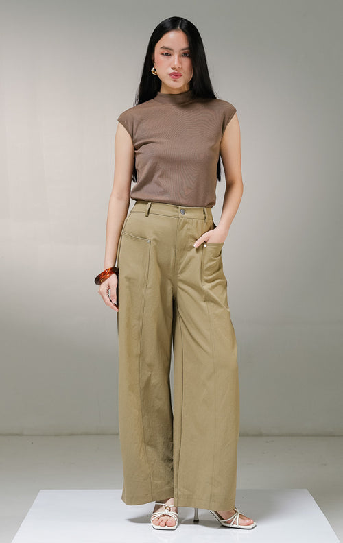 Celana panjang wanita This Is April Eleinna Pants warna khaki, model celana kain kerja highwaist dengan kancing depan silver rivet, tempat sabuk, saku samping dalam, dan karet pinggang elastis belakang.