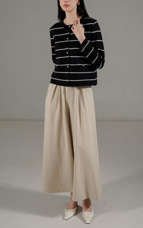 Gabrielle Cardigan Black dari This Is April, cardigan rajut hitam motif garis putih (stripe) dengan kancing metalik dan detail faux pocket.