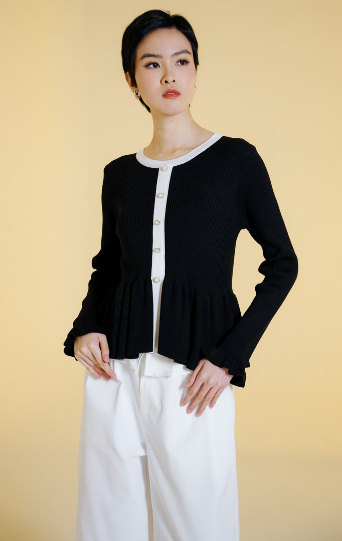 Pakaian hangat wanita model cardigan rajut salur lengan panjang berkerah bulat dengan potongan peplum dan kancing depan (rib knit peplum cardigan) warna hitam Lexie Cardigan untuk gaya kantor dan kasual anggun.