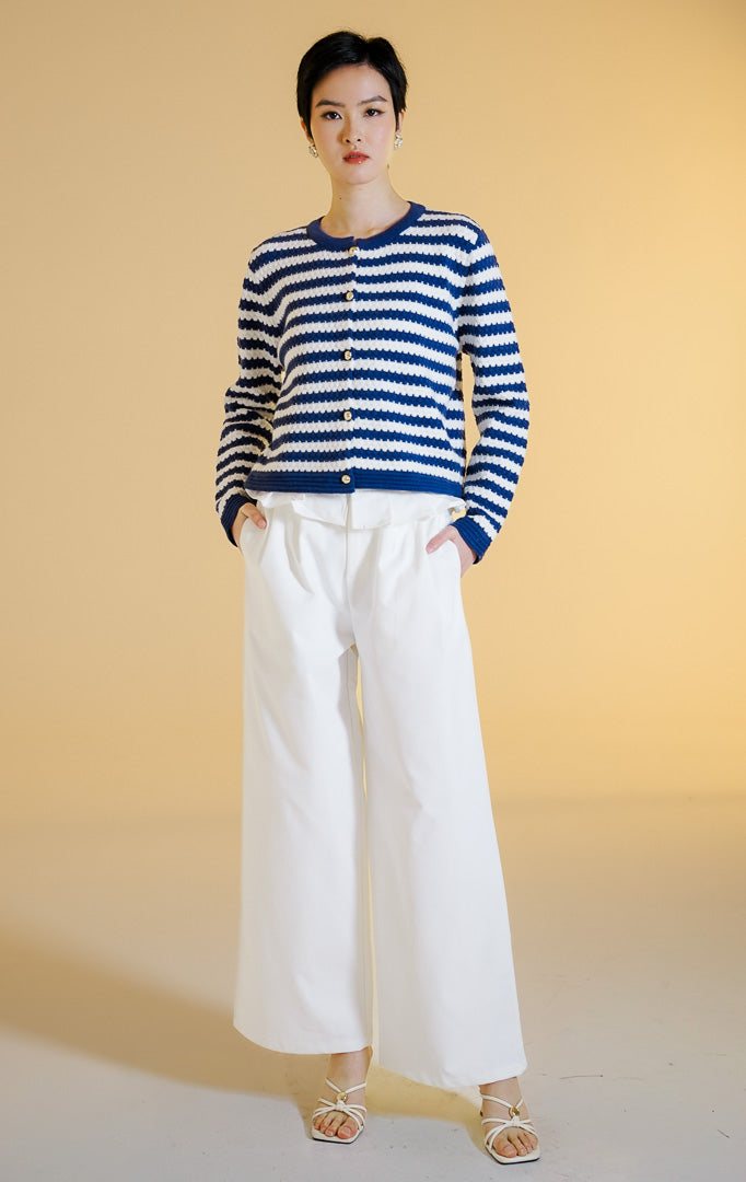 Pakaian hangat wanita model cardigan rajut lengan panjang berkerah bulat kancing depan motif garis dengan detail tekstur timbul (striped bobble knit cardigan) warna navy Lucerne Cardigan untuk gaya kantor dan kasual anggun.