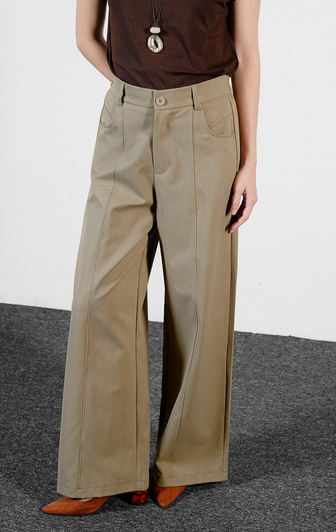 Bawahan wanita model celana panjang katun twill potongan lebar (brown center-seam wide-leg pants) Ottile Pants dengan detail garis tengah dan siluet modern yang rapi.