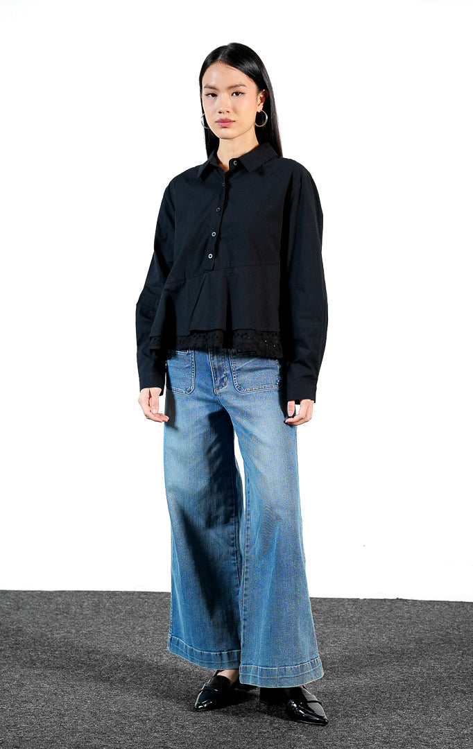 Pakaian wanita model kemeja katun lengan panjang dengan detail bordir lubang pada bagian bawah peplum (eyelet broderie peplum shirt) warna hitam Yoren Top untuk gaya kasual elegan yang chic.