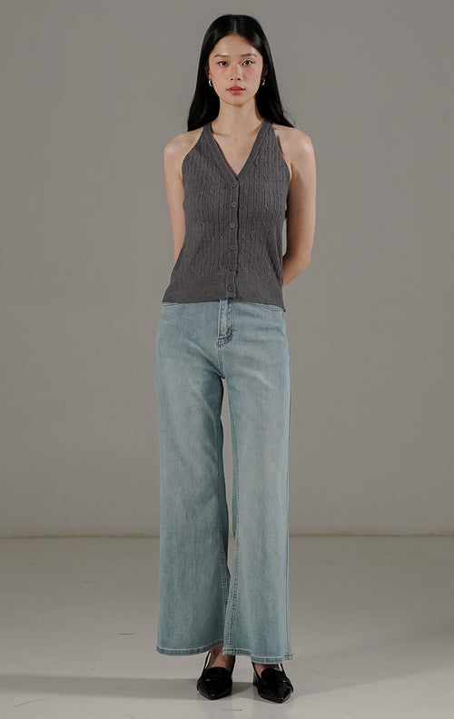 Anazelia Top Dark Grey dari This Is April, atasan rajut crop tanpa lengan (halter style) dengan kancing aktif dan tekstur cable knit.