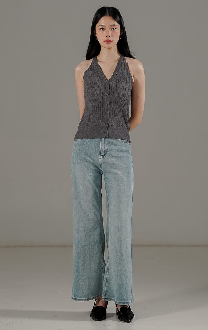 Anazelia Top Dark Grey dari This Is April, atasan rajut crop tanpa lengan (halter style) dengan kancing aktif dan tekstur cable knit.