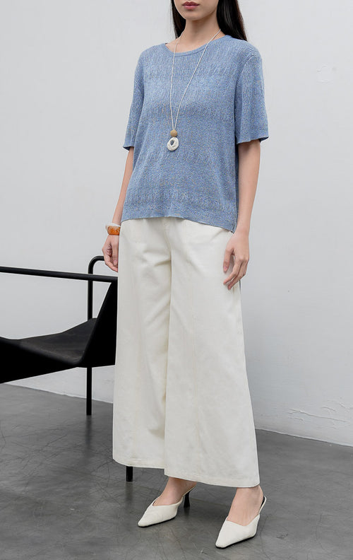 Atasan rajut wanita lengan pendek warna biru (blue) Anatella Top dengan kerah bulat (crew-neck) dan tekstur rajut halus (fine textured knit).