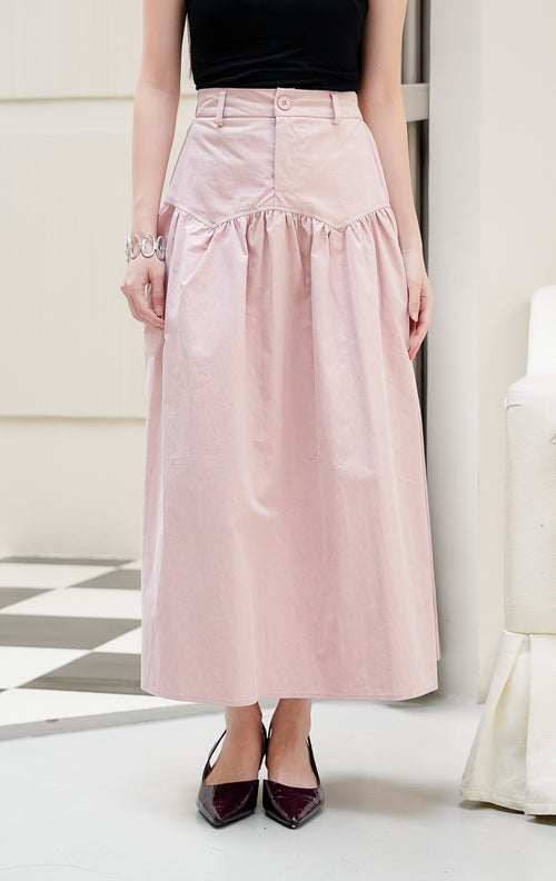Rok panjang maxi wanita Owen Skirt warna dusty pink berpotongan A-line berbahan katun poplin dengan detail front button dan zipper. 
