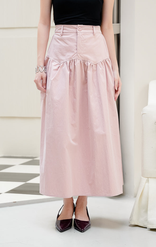Rok panjang maxi wanita Owen Skirt warna dusty pink berpotongan A-line berbahan katun poplin dengan detail front button dan zipper. 