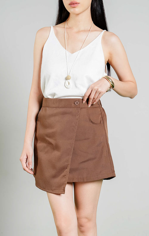 Samara Asymmetric Wrap Skort warna brown, rok celana pendek wanita model asimetris bahan katun twill warna cokelat dari This Is April. 