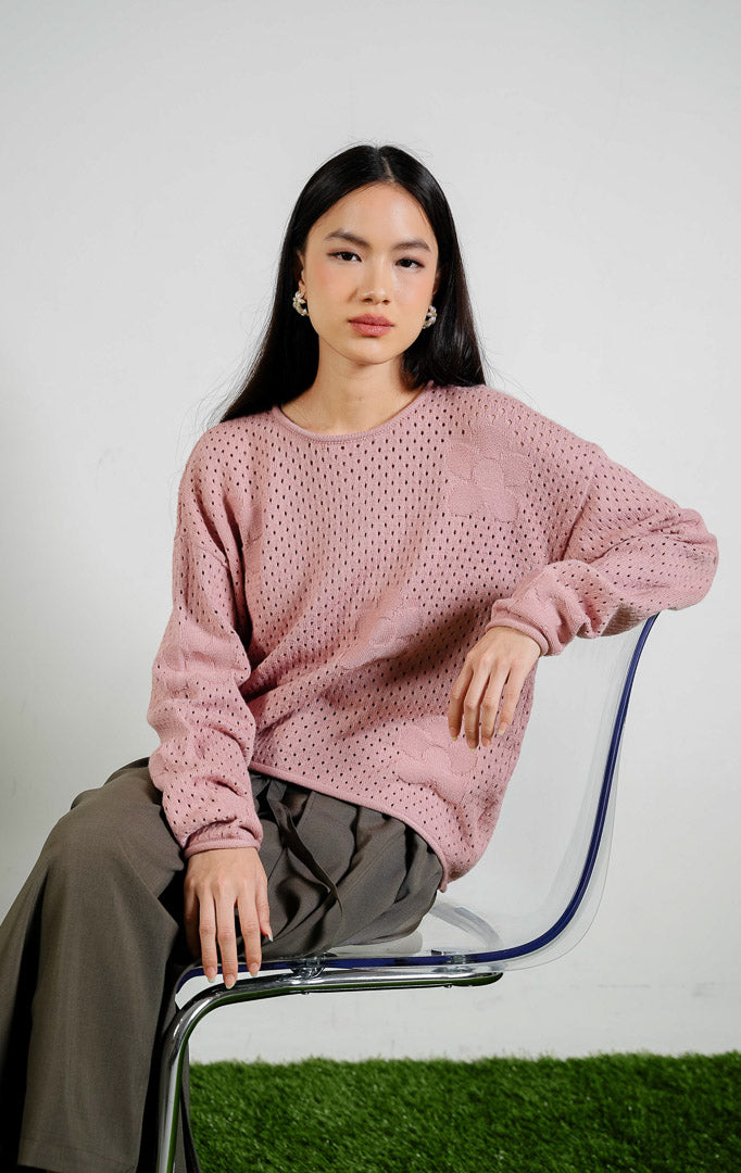 August Perforated Pointelle Flower Knit Sweater warna pink, baju sweter rajut lengan panjang wanita warna merah muda dengan motif rajutan bunga berlubang halus dari This Is April. 