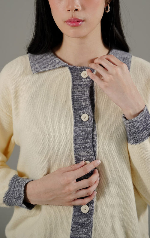 Aysel Cardigan Ivory dari This Is April, cardigan rajut lengan panjang warna putih ivory dengan detail kerah dan garis kancing kontras abu-abu