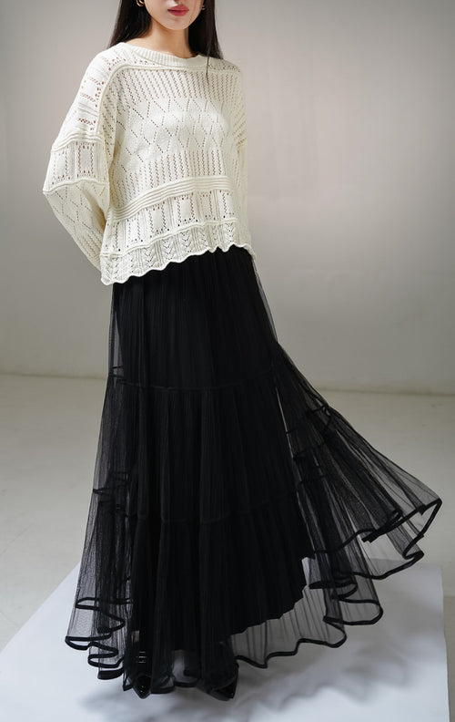 Atasan sweater rajut lengan panjang wanita This Is April Clarissa Sweater warna ivory (krem terang), model jaring mesh knit transparan dengan pola rajutan belah ketupat dan garis vertikal. 
