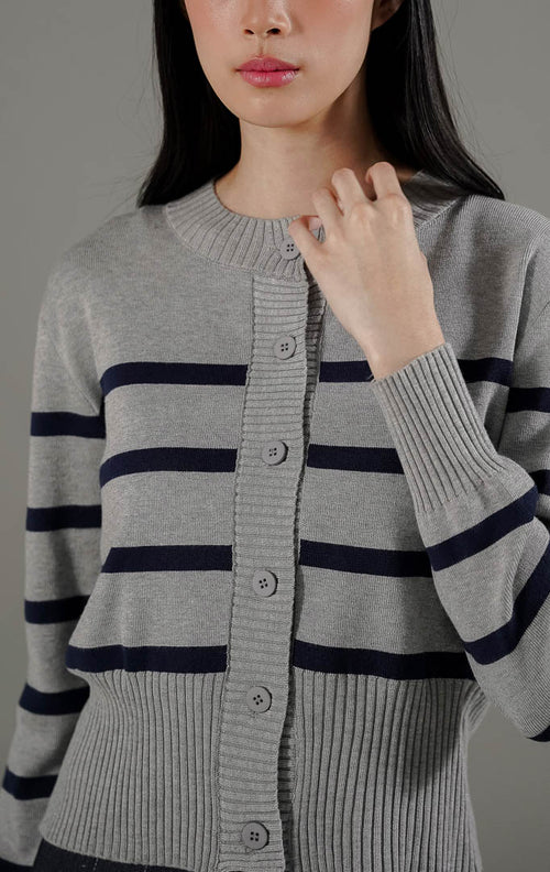  Darcy Cardigan Grey dari This Is April, cardigan rajut lengan panjang warna abu-abu dengan motif garis-garis navy dan kancing depan.