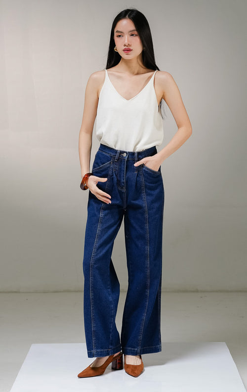Celana panjang jeans wanita This Is April Gwen Pants warna dark denim (biru tua), model high-waist straight leg dengan detail saku samping depan dan aksen jahitan vertikal di bagian tengah kaki.