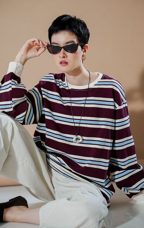 Yebin Sweater Maroon dari This Is April, sweater oversized wanita motif garis maroon, biru muda, dan putih dengan material katun.
