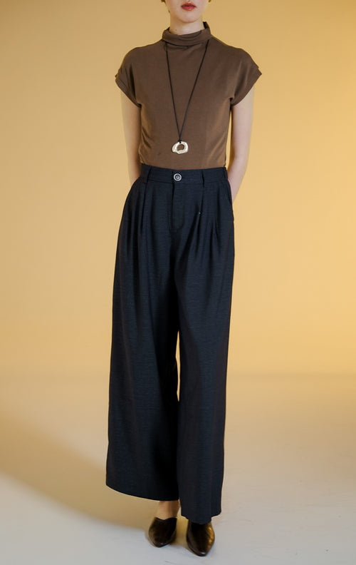 Pakaian wanita model celana kulot lebar bermotif tekstur melange (melange wide-leg tailored pants) warna navy Anouk Pants untuk gaya kantor dan kasual yang anggun. 