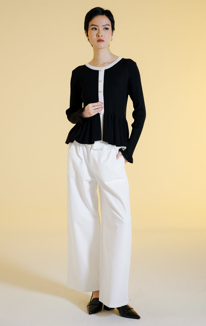 Pakaian hangat wanita model cardigan rajut salur lengan panjang berkerah bulat dengan potongan peplum dan kancing depan (rib knit peplum cardigan) warna hitam Lexie Cardigan untuk gaya kantor dan kasual anggun. 
