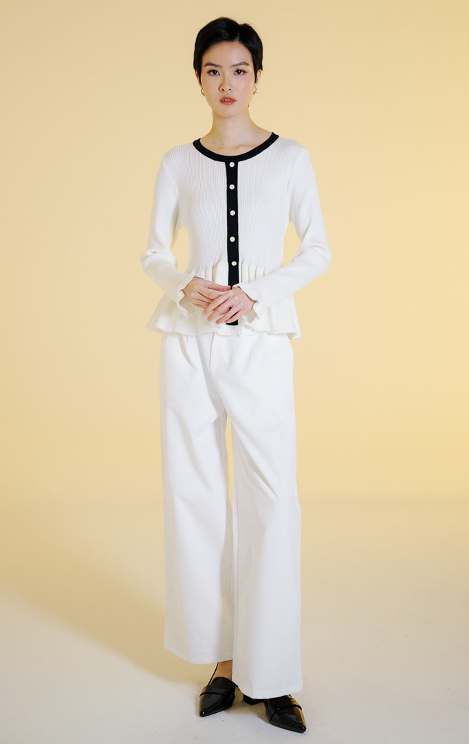 Pakaian hangat wanita model cardigan rajut salur lengan panjang berkerah bulat dengan potongan peplum dan kancing depan (rib knit peplum cardigan) warna putih Lexie Cardigan untuk gaya kantor dan kasual anggun. 