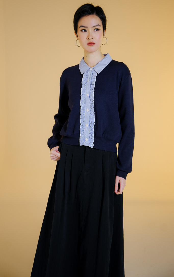 Pakaian hangat wanita model cardigan rajut lengan panjang kancing depan dengan detail kerah dan lis rempel motif garis (ruffled pinstripe knit cardigan) warna navy Maggie Cardigan untuk gaya kantor dan kasual anggun. 