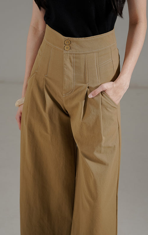 Marcela Pants Khaki dari This Is April, celana panjang wanita highwaist warna khaki dengan detail dua kancing depan dan saku samping aktif.