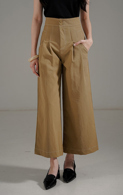 Marcela Pants Khaki dari This Is April, celana panjang wanita highwaist warna khaki dengan detail dua kancing depan dan saku samping aktif.