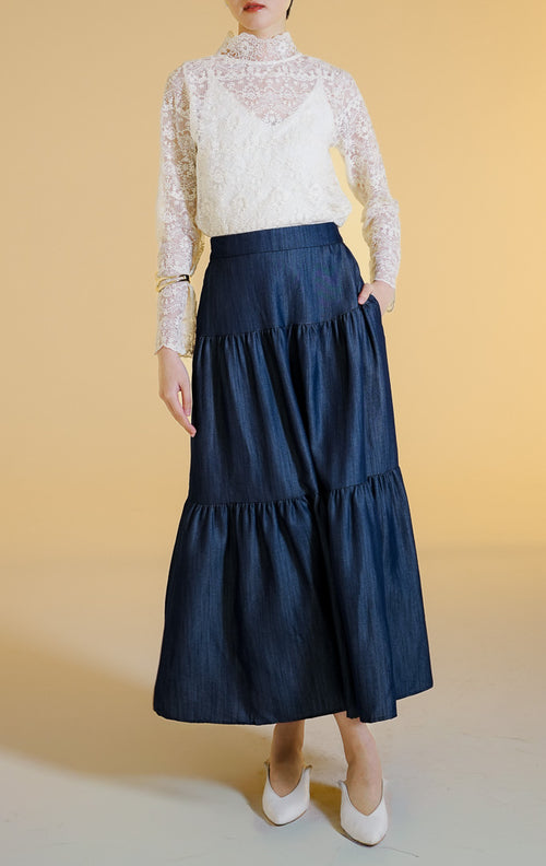 Pakaian wanita model rok panjang maxi bertingkat bahan jeans (tiered denim maxi skirt) warna dark denim Morita Skirt untuk gaya kantor dan kasual anggun. 