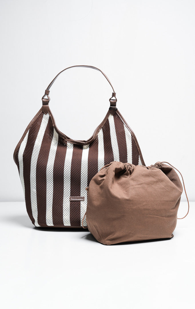 Tas wanita model hobo bag bahan rajut jaring motif garis warna cokelat dan putih (brown striped open-knit mesh hobo bag) Odessa Bag dengan detail tali pegangan yang nyaman dan elegan. 